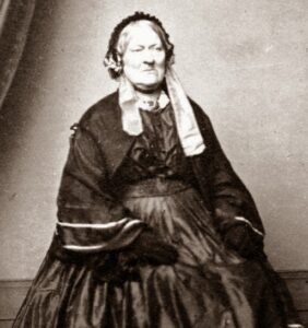 Victorian photograph of Lily Maxwell sat down. The first women voter in 1867,